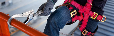 Roofer wearing a harness