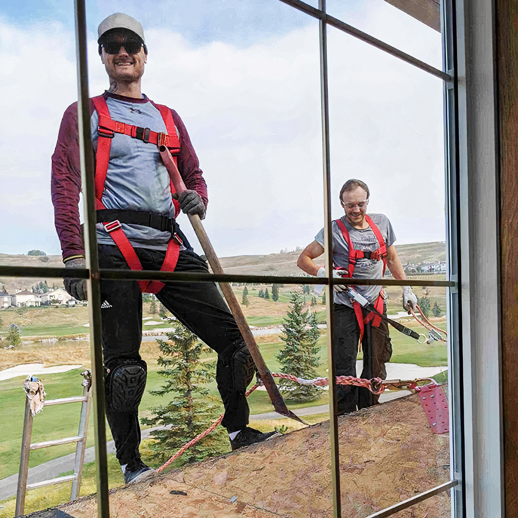 Workers on roof through window in Calgary