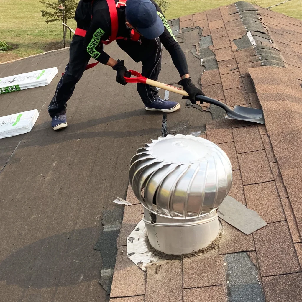 Roofer removing old roof