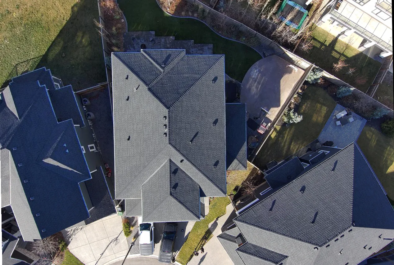 Overhead view of a finished roof replacement in Aspen Woods, Calgary