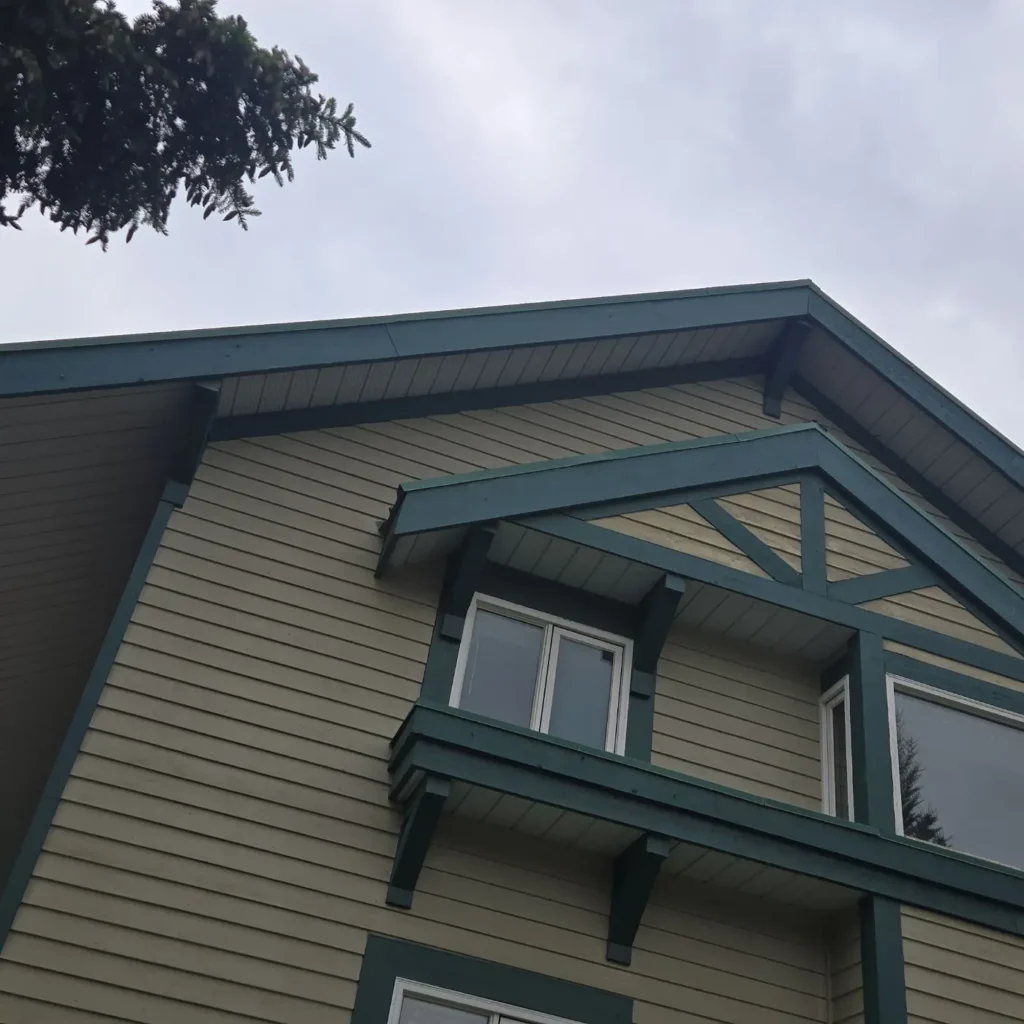 Gable end and upper-floor windows of a multi-storey apartment building in Banff