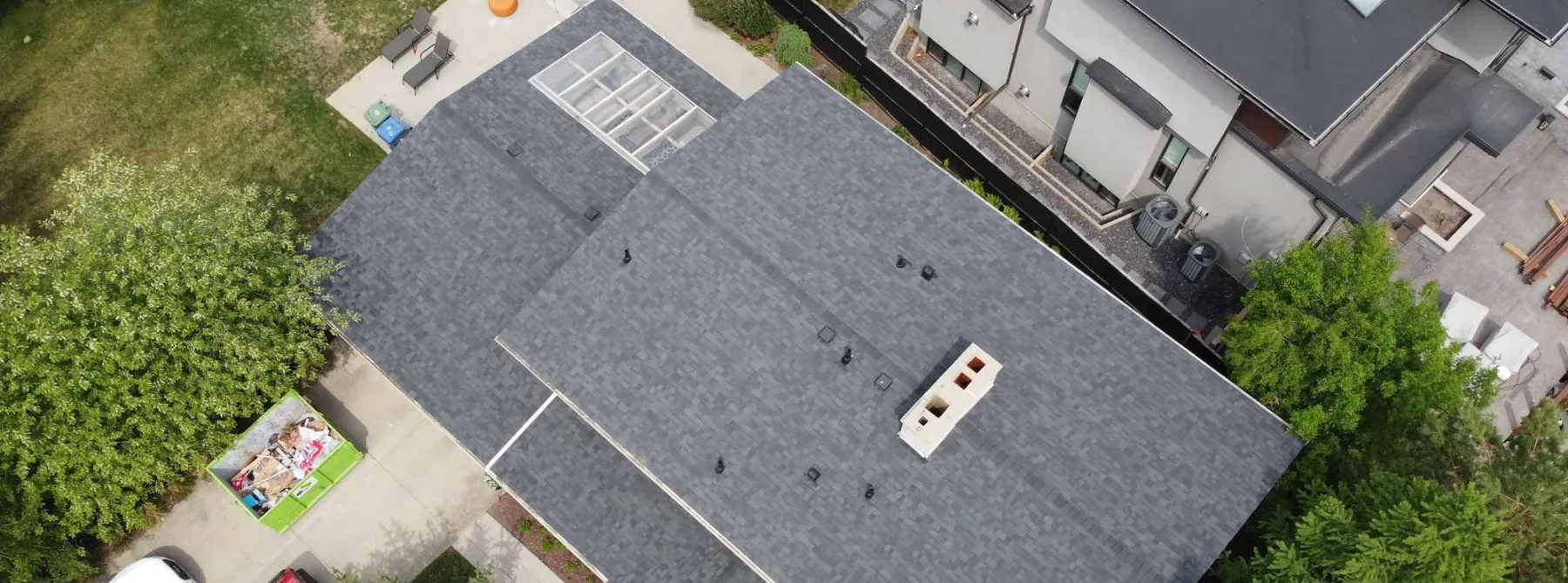 Finished grey architectural shingle roof on an inner southwest Calgary home, seen from above