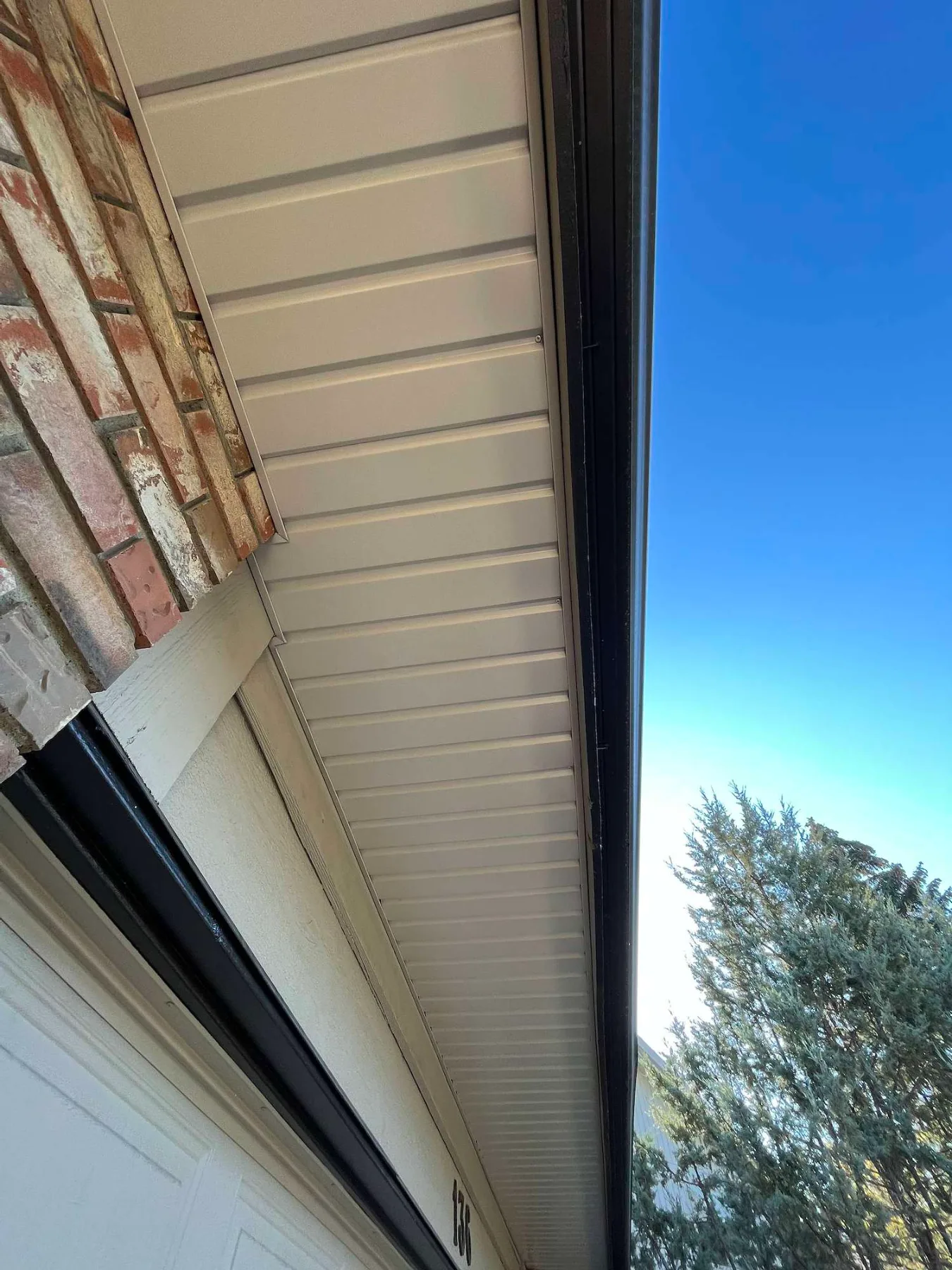 New vented soffit and fascia over the garage on a Calgary home