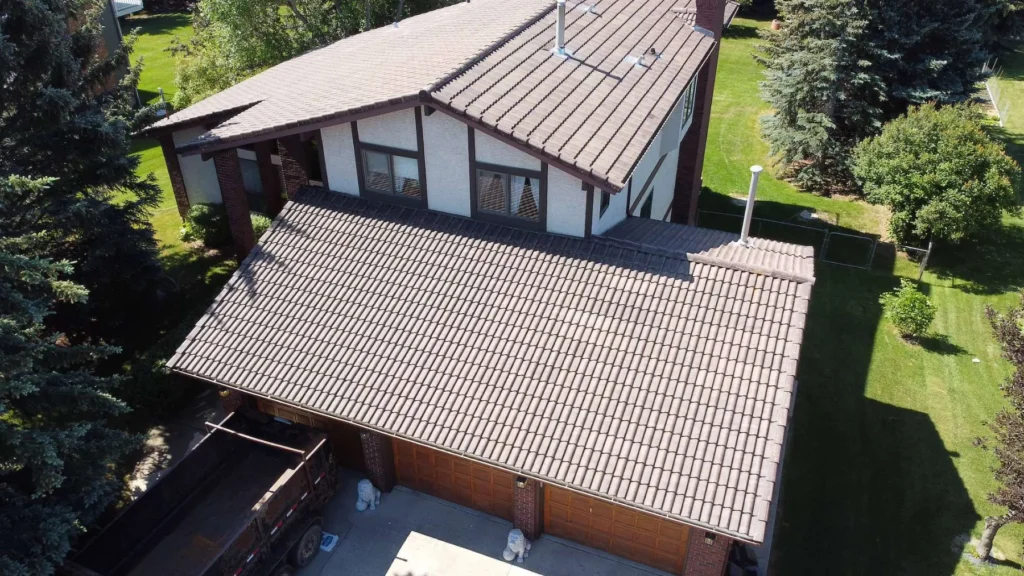 Old concrete tile roof on a Dalhousie, Calgary home before replacement, drone view