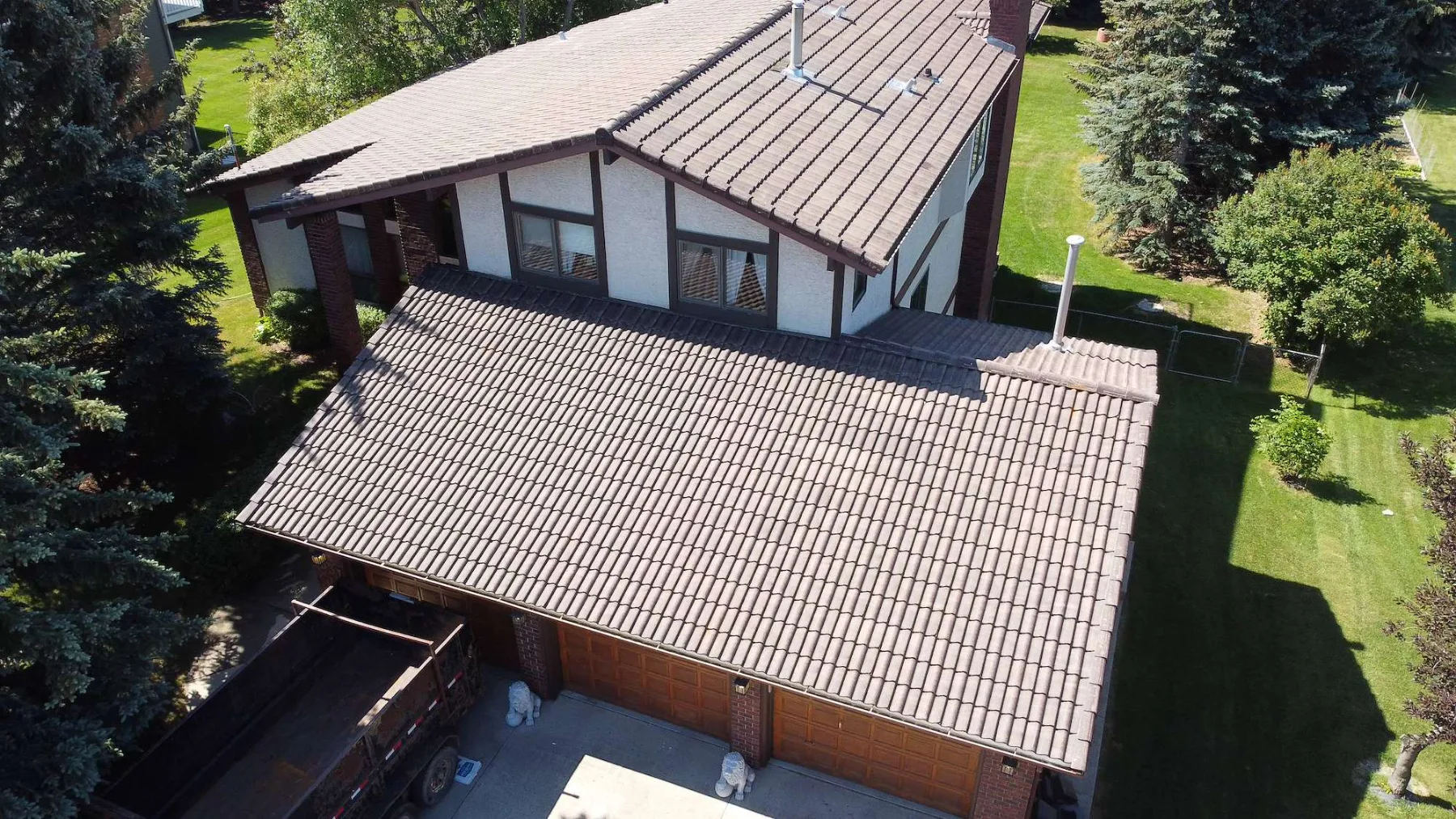 Old concrete tile roof on a Dalhousie, Calgary home before replacement, seen from above