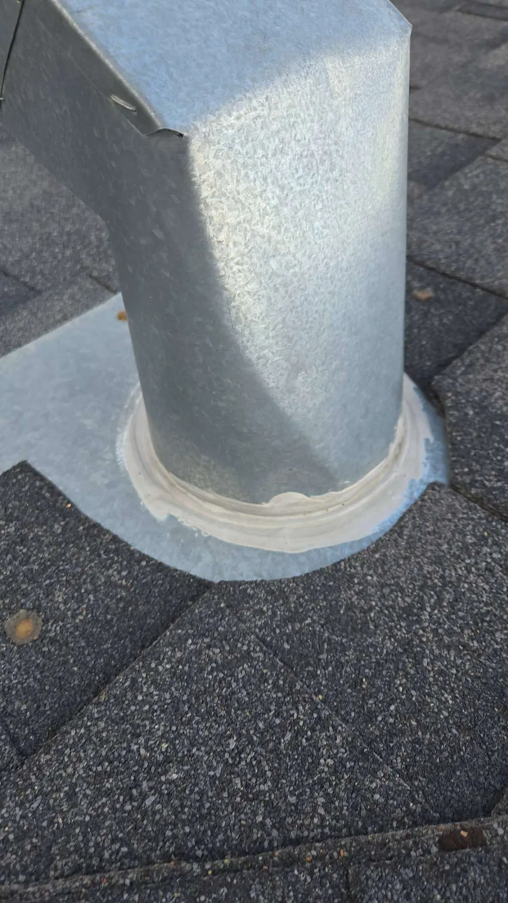 Worn plumbing pipe flashing on a Kincora, Calgary roof during an inspection