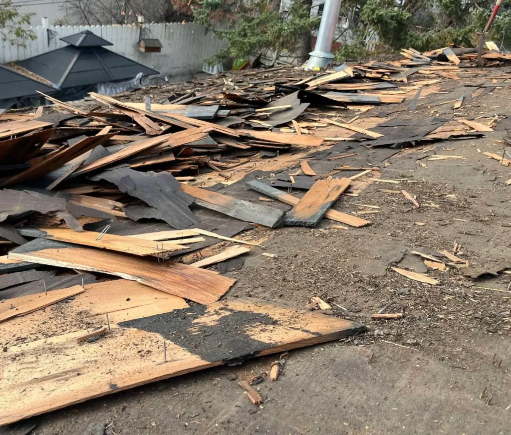 Old cedar shakes torn off during a roof replacement in Marda Loop, Calgary