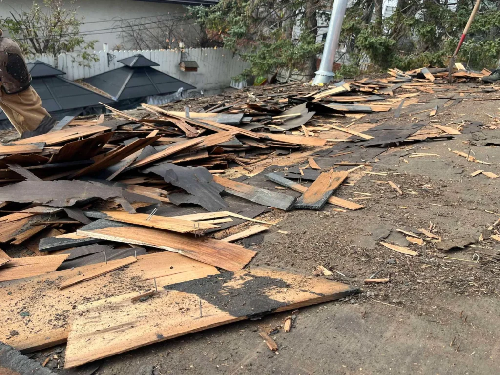 Old cedar shakes torn off during a roof replacement in Marda Loop, Calgary