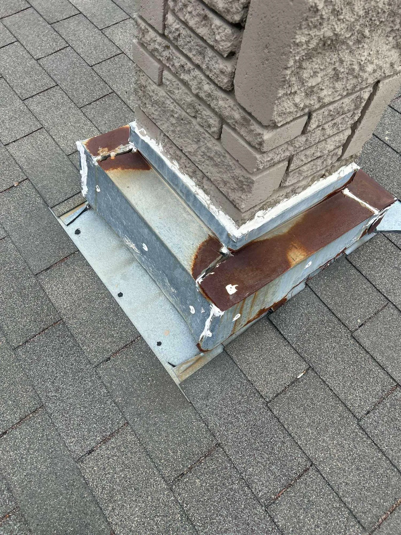 Rusted chimney flashing found during a roof inspection in Mayfair, Calgary
