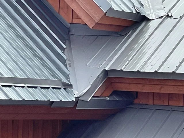 Close-up of a metal valley and trim on a standing-seam roof