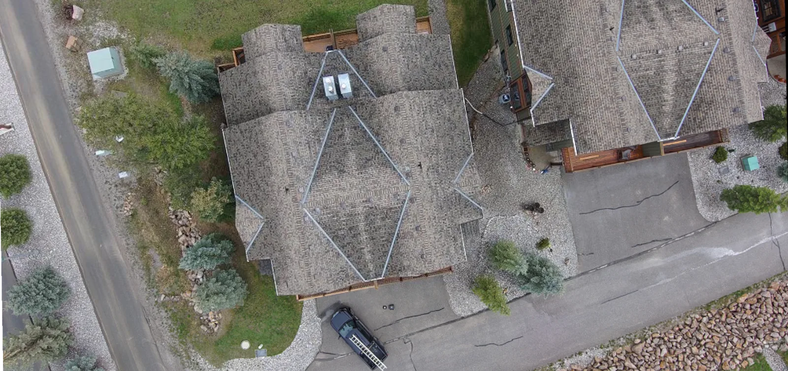 Drone view of a strata townhome roof with new shingles