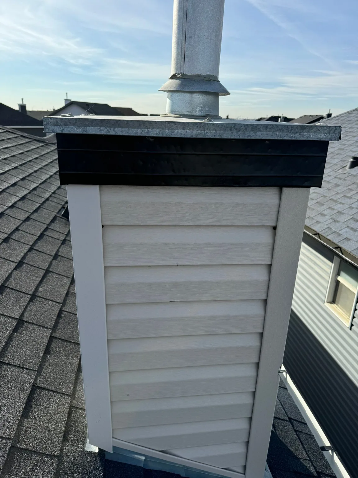 A chimney chase checked for hail damage, Calgary