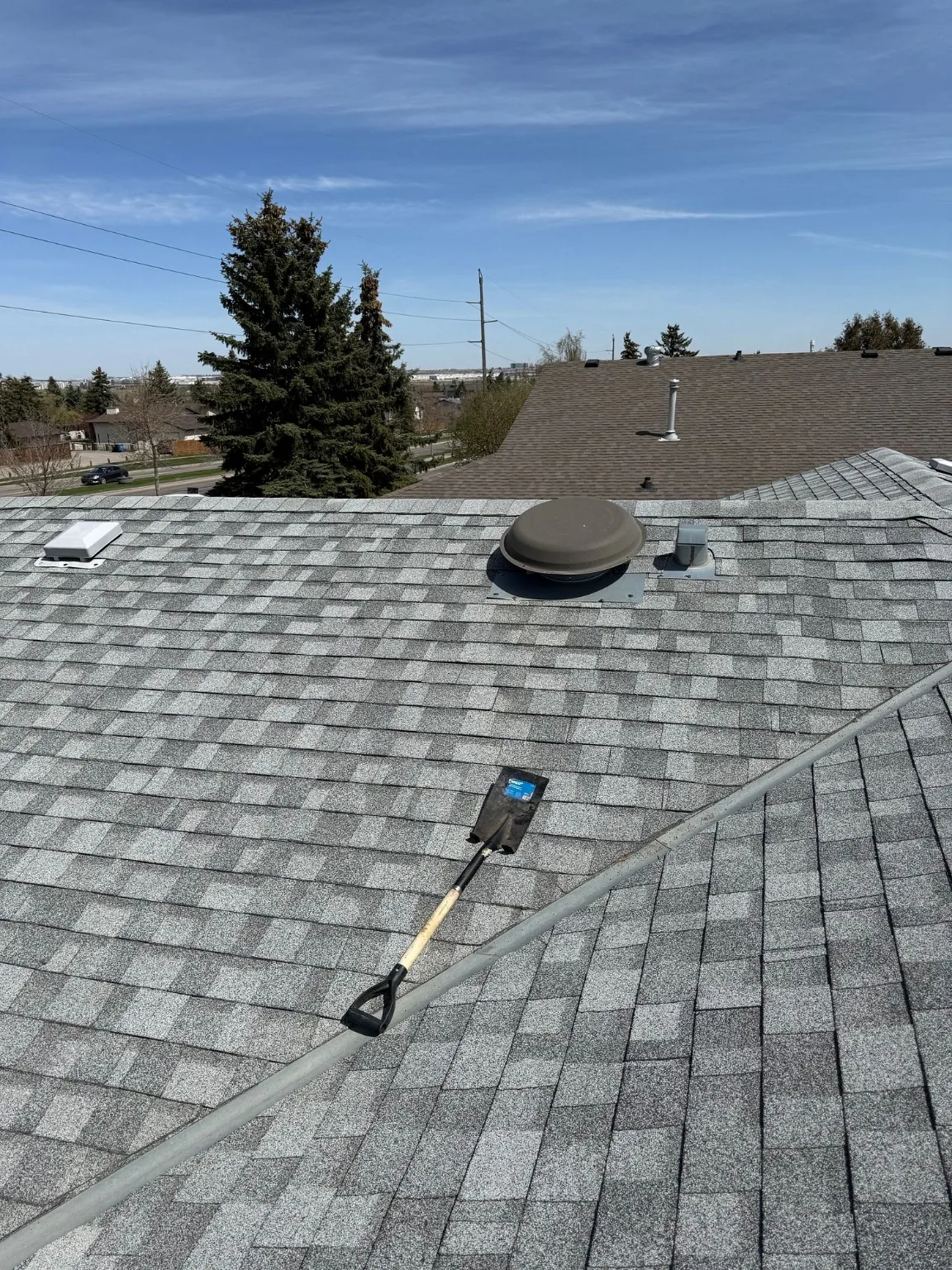 A roof inspected for wind damage, Calgary
