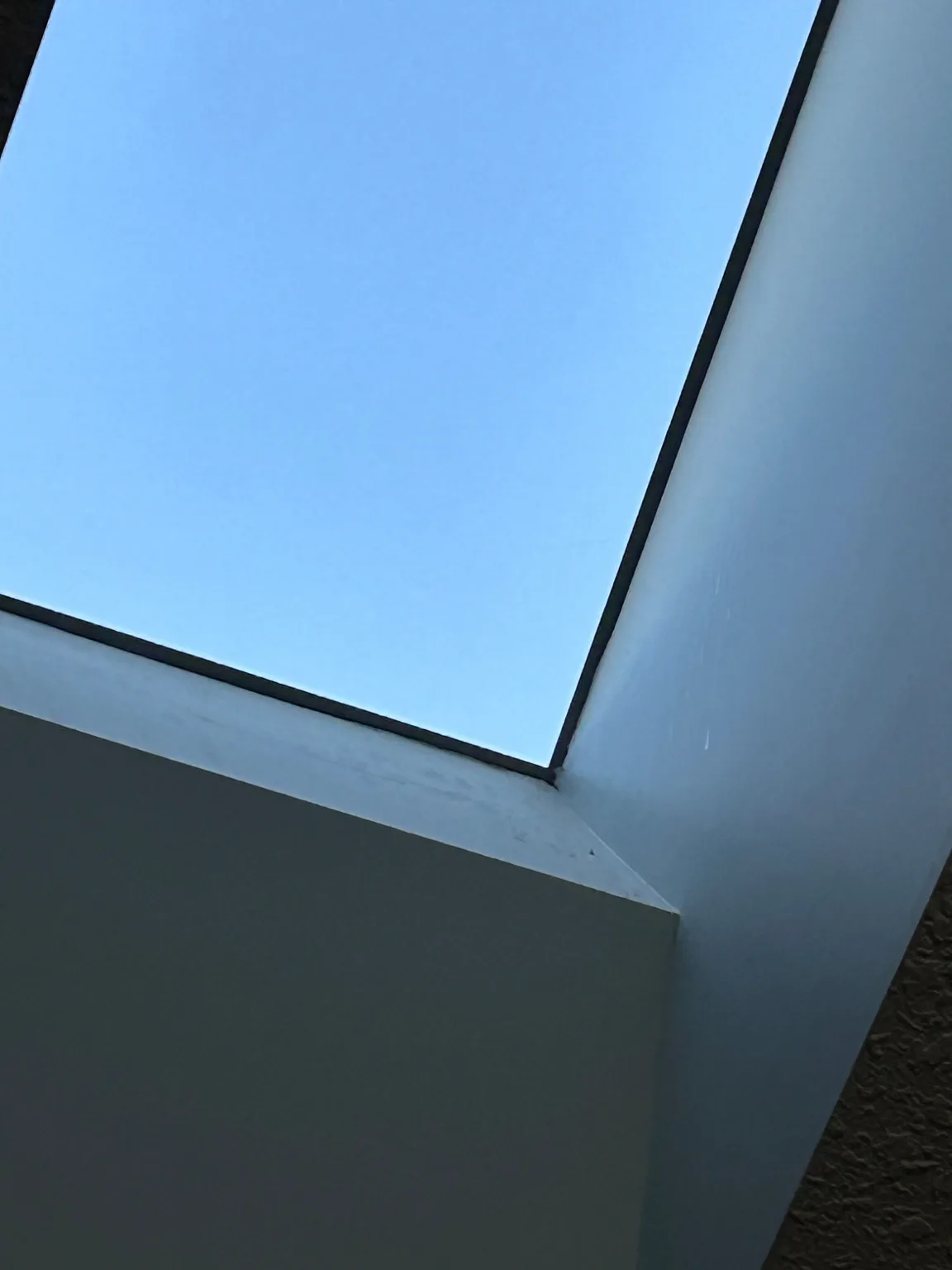 A skylight well checked during a hail inspection, Calgary