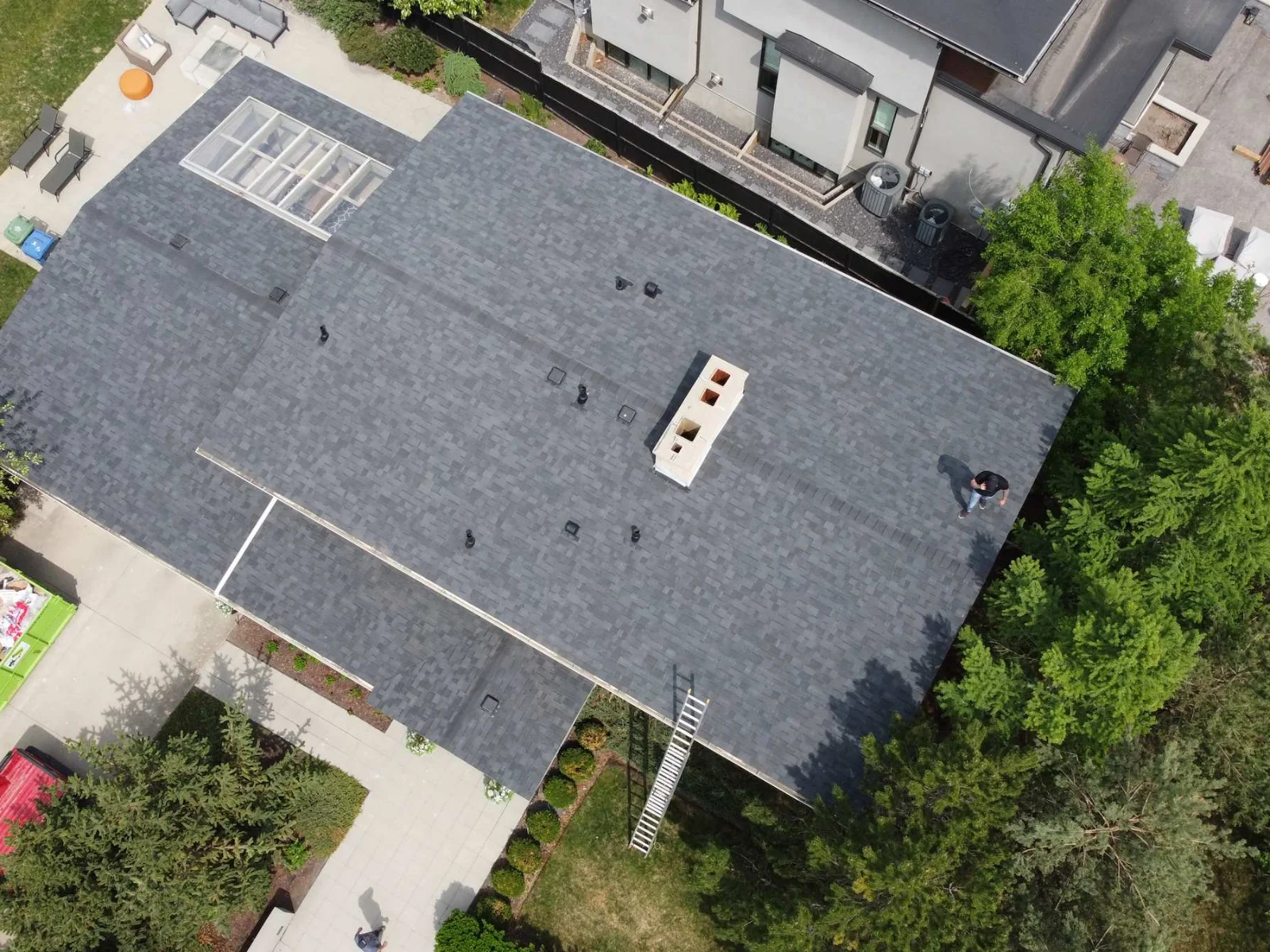 Overhead view of the finished grey shingle roof, southwest Calgary, AB