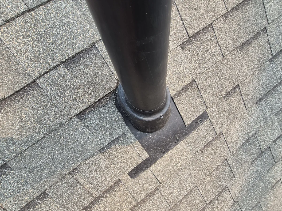 New plumbing vent boot on an Edgewater shingle roof