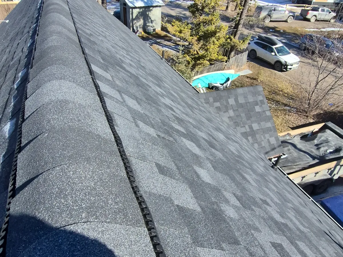 New ridge cap shingles on an Edgewater home