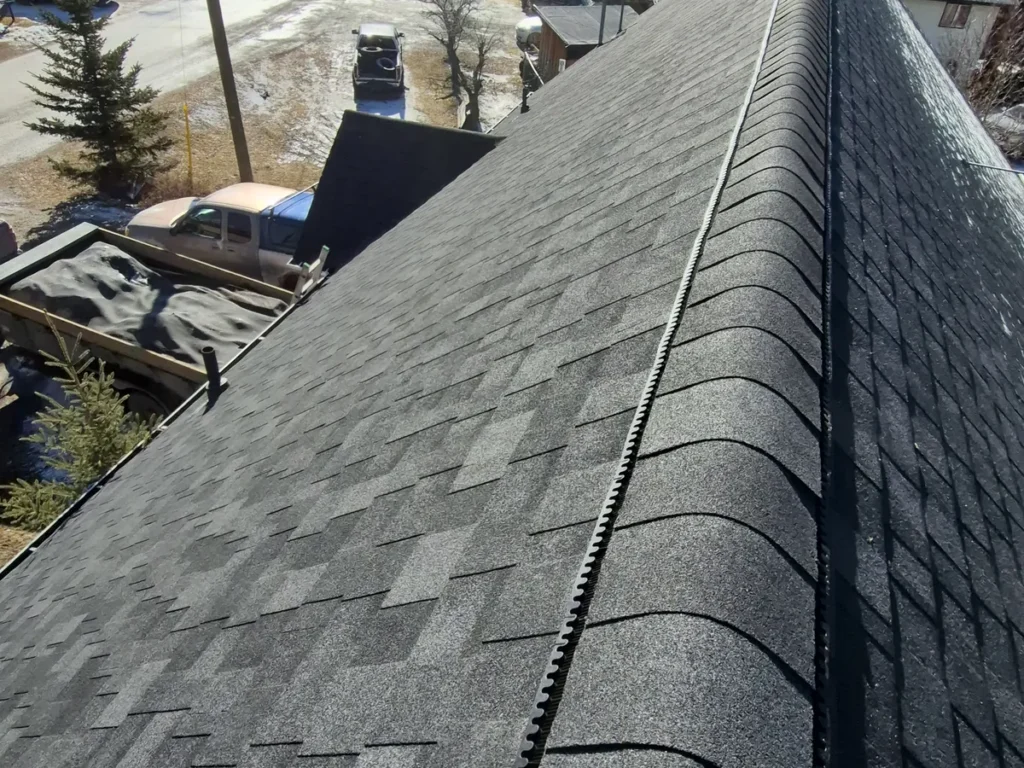 New shingles and ridge cap on an Edgewater roof