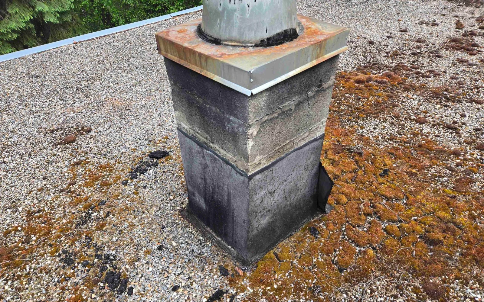 The base of a chimney on the gravel roof, Golden, BC
