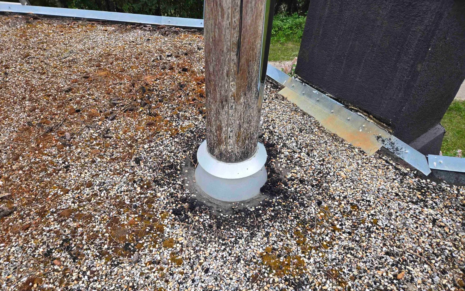 A vent stack through the gravel roof, Golden, BC