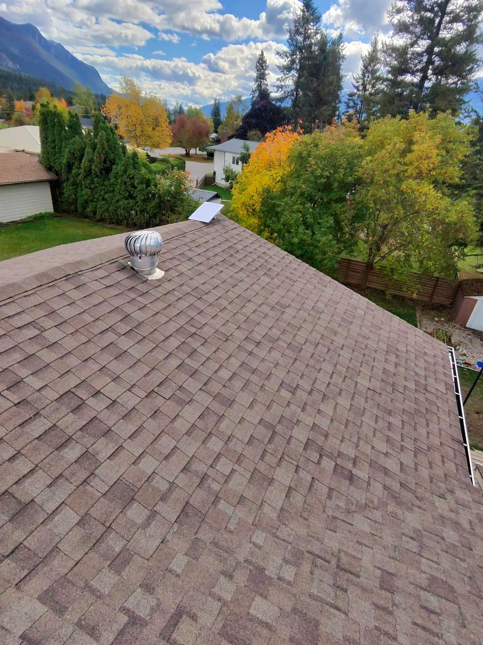 A roof slope with sealed shingle tabs, Golden, BC