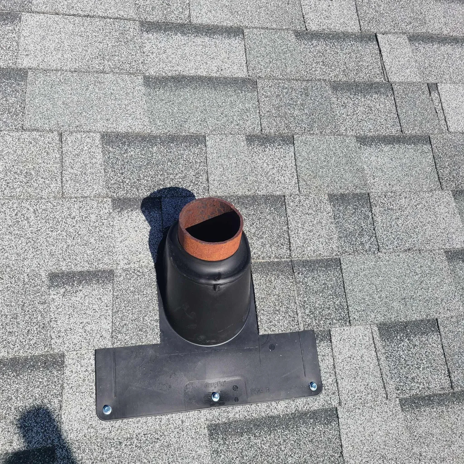 Pipe flashing on new shingles, High River