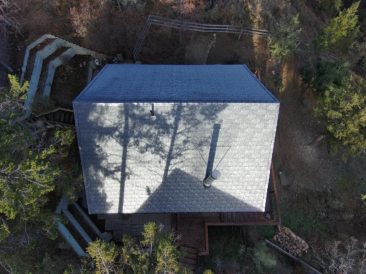 Overhead drone view of a new rubber roof on an A-frame cabin, Invermere, BC