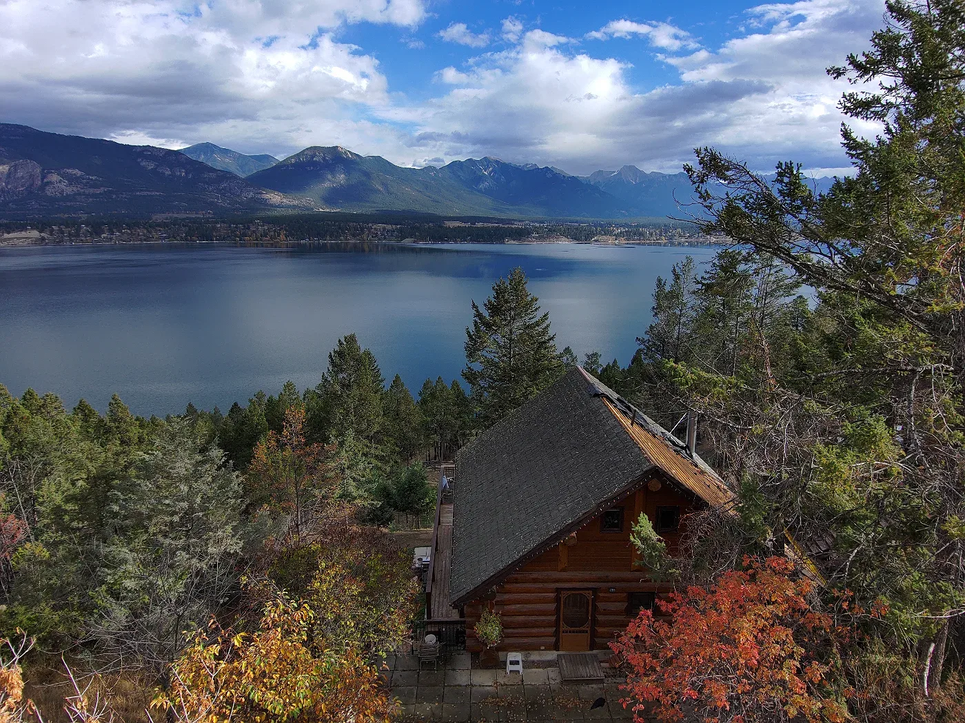 Log cabin among the trees above Lake Windermere, Invermere, BC