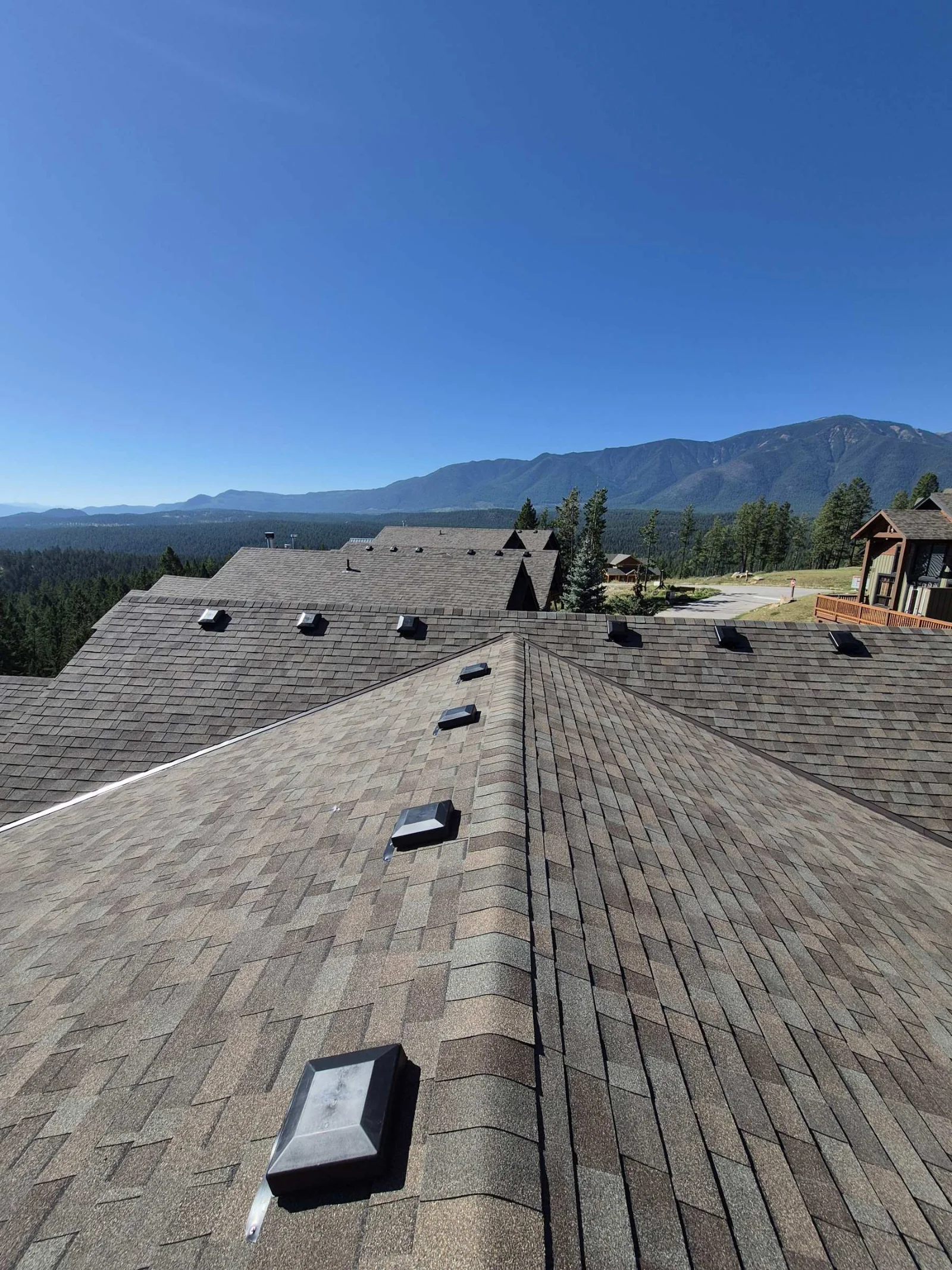A finished roof with Lake Windermere and the mountains behind, Invermere, BC