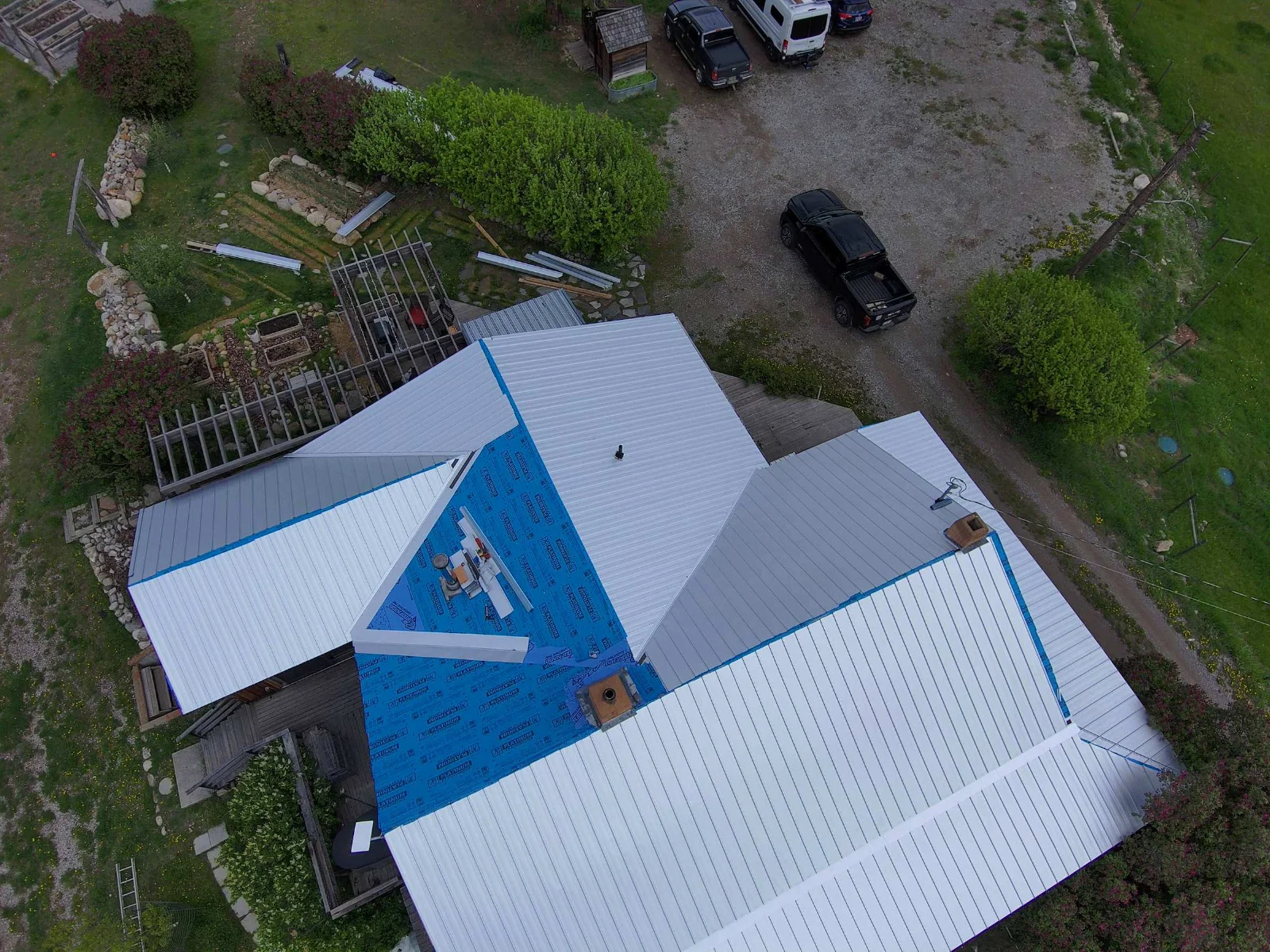 The same view mid-install, with new snap-lock steel panels going on, Invermere, BC