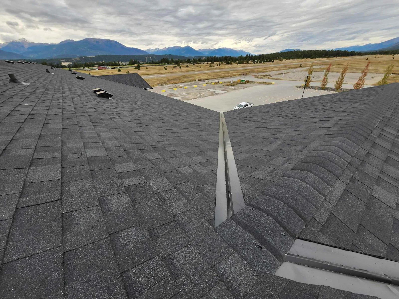 A new open metal valley on the finished hotel roof, Invermere, BC
