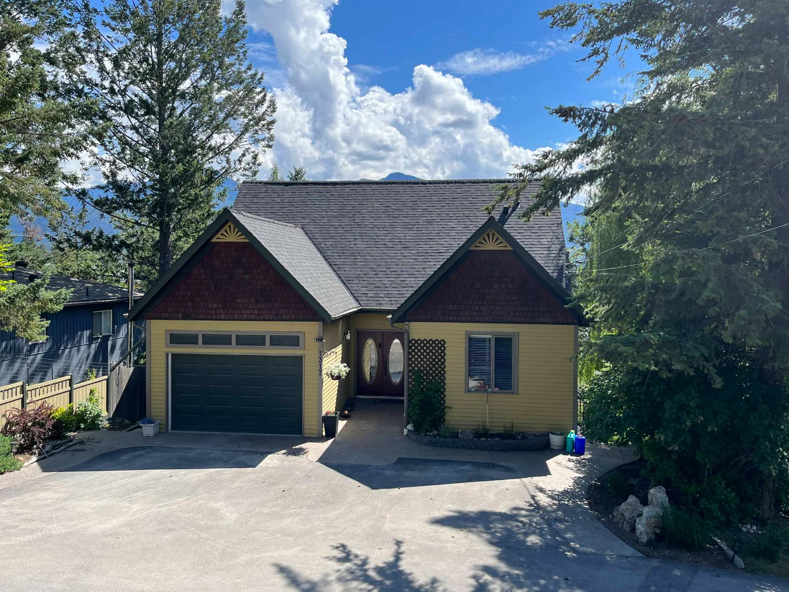 The front of the home after the cedar shake was replaced with Malarkey Legacy shingles, Invermere, BC