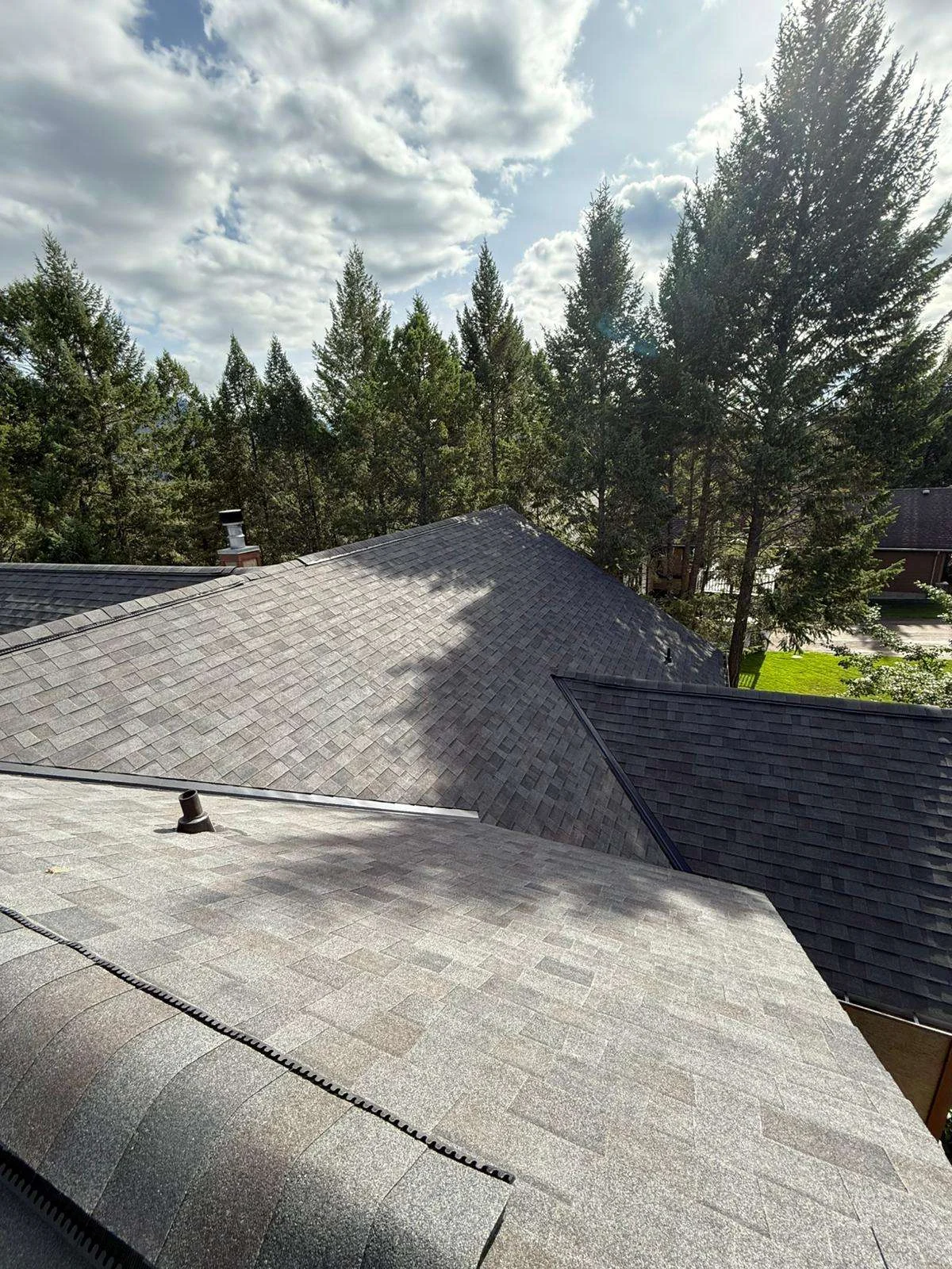 New shingles and hips with the mountains behind, Invermere, BC
