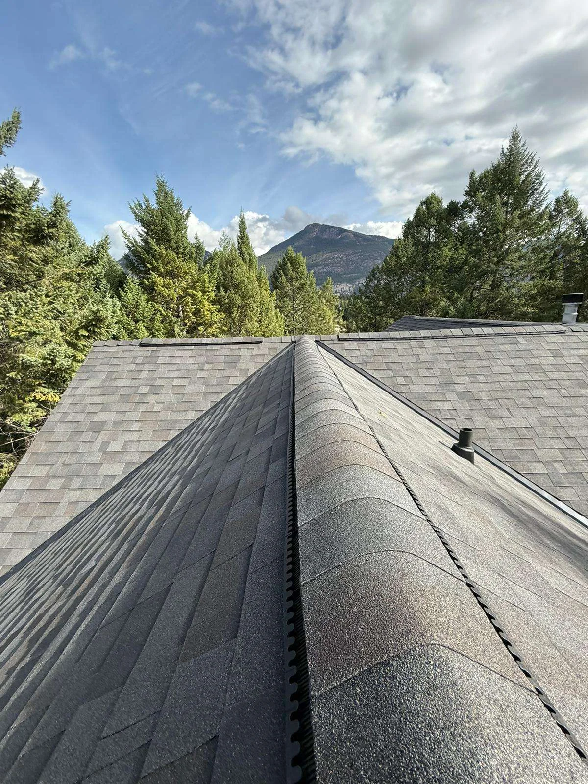 New ridge cap running along the finished roof, Invermere, BC