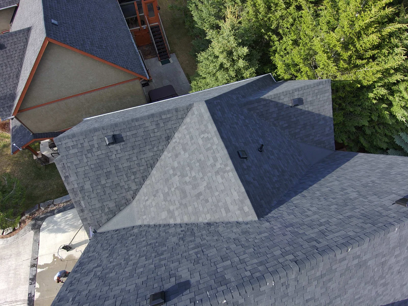 New Malarkey Legacy shingles and ridge cap on a steep hip section, Invermere, BC