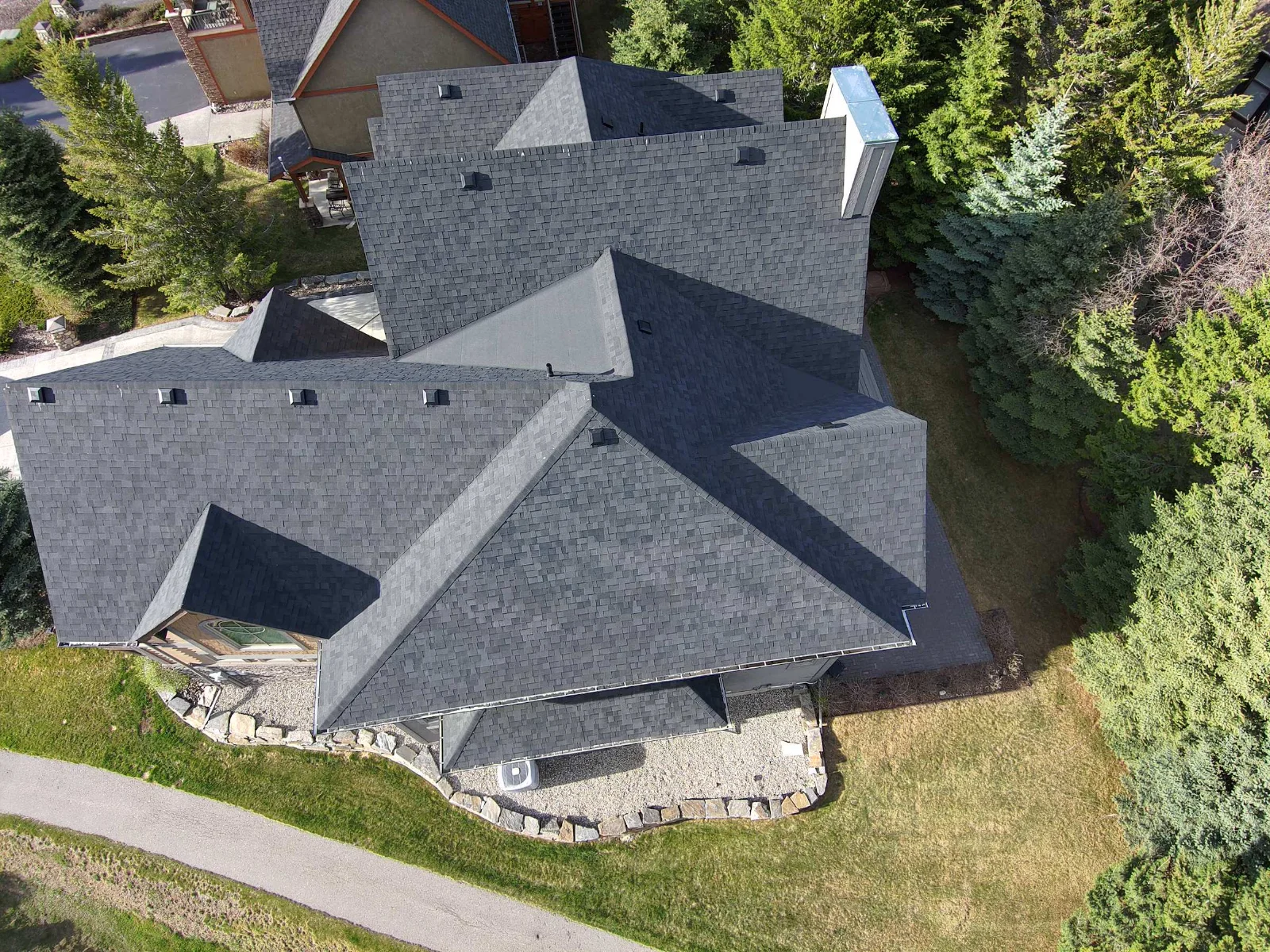 The same roof from the same angle after replacement with Malarkey Legacy shingles in Midnight Black, Invermere, BC