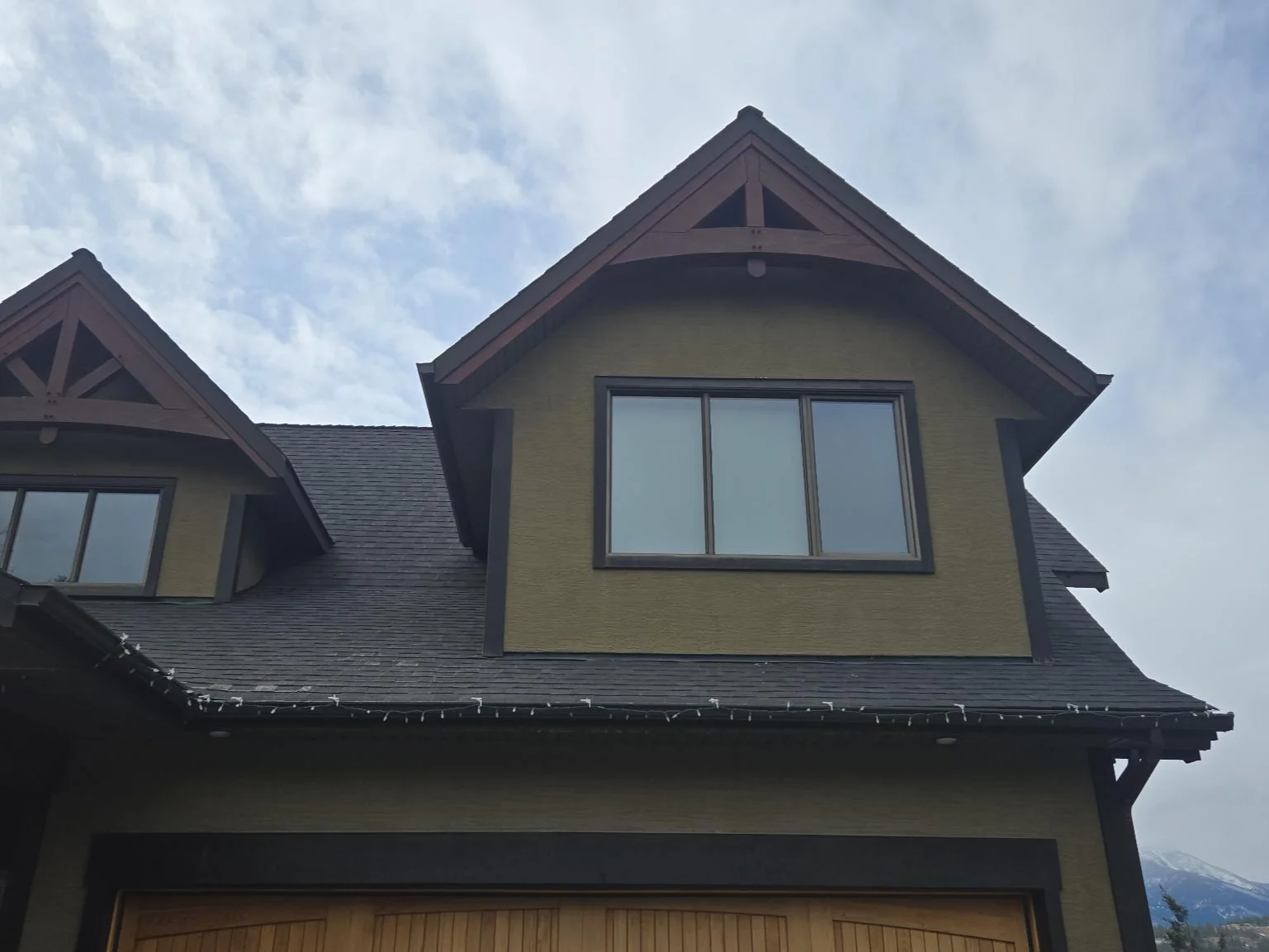 A home with a windstorm-damaged roof, Invermere, BC