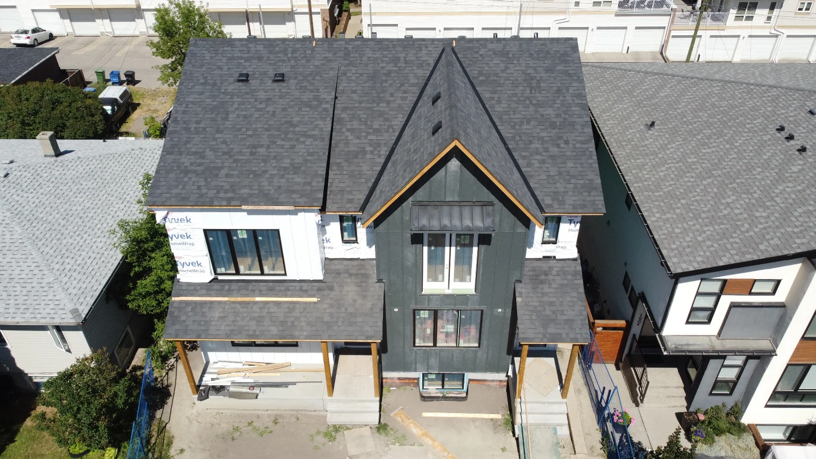 Higher aerial view of the Marda Loop infill showing the new siding, roofline and neighbouring homes