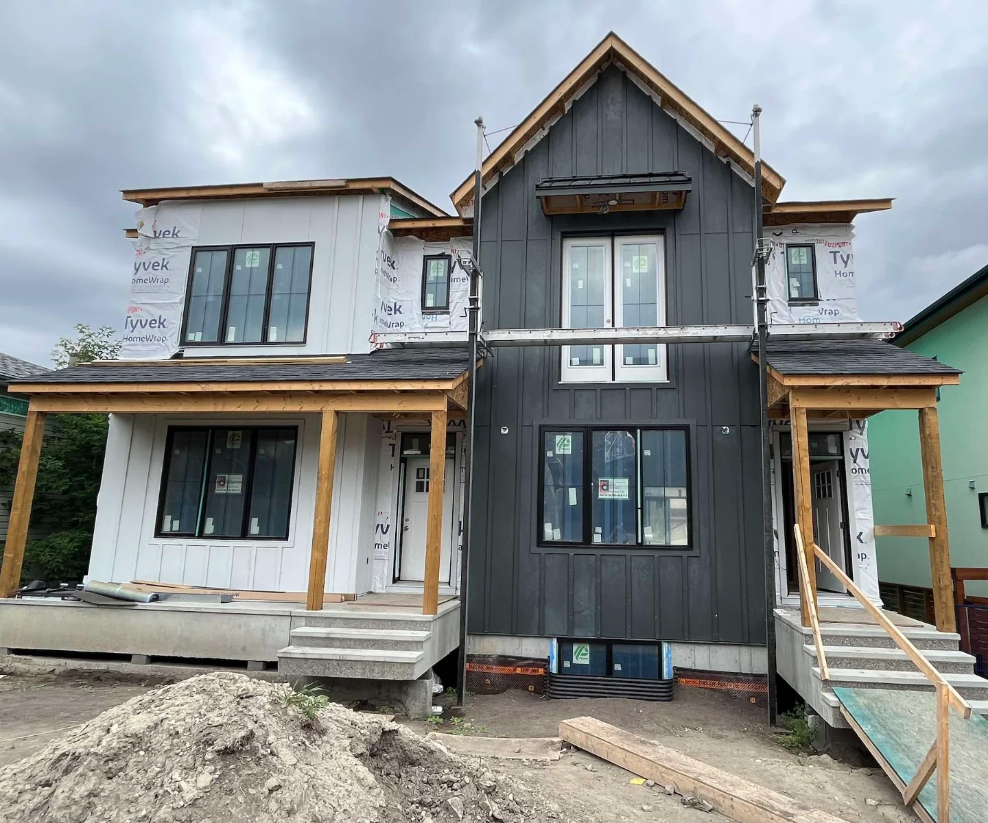 Street-level view of the James Hardie board-and-batten siding on the Marda Loop home