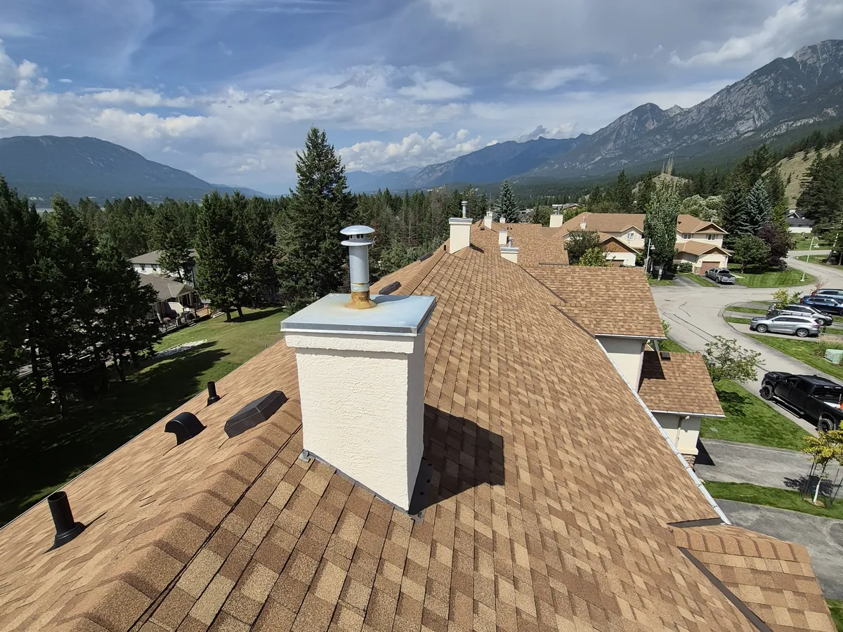 New shingle roof and chimney on a Radium Hot Springs townhome