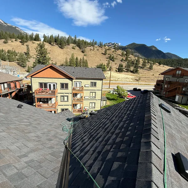 New shingle roof on a Radium Hot Springs condo building with mountain views