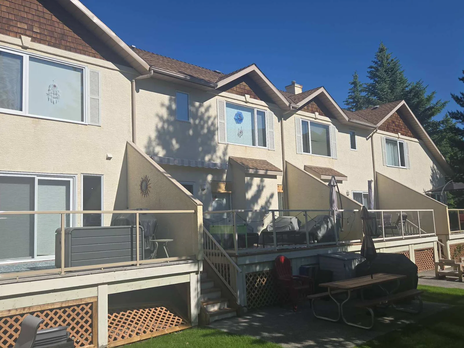 The rear of the townhome buildings before the roof replacement, Radium Hot Springs, BC