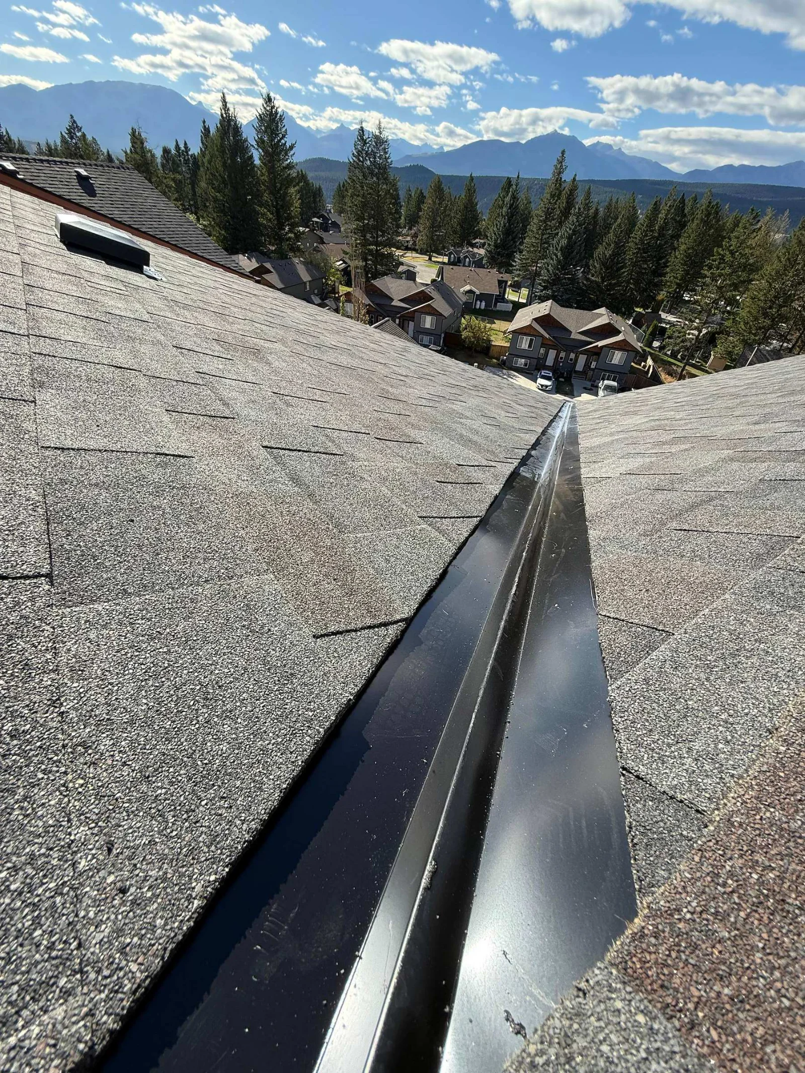 A new open metal valley with fresh shingles on both sides, Radium Hot Springs, BC