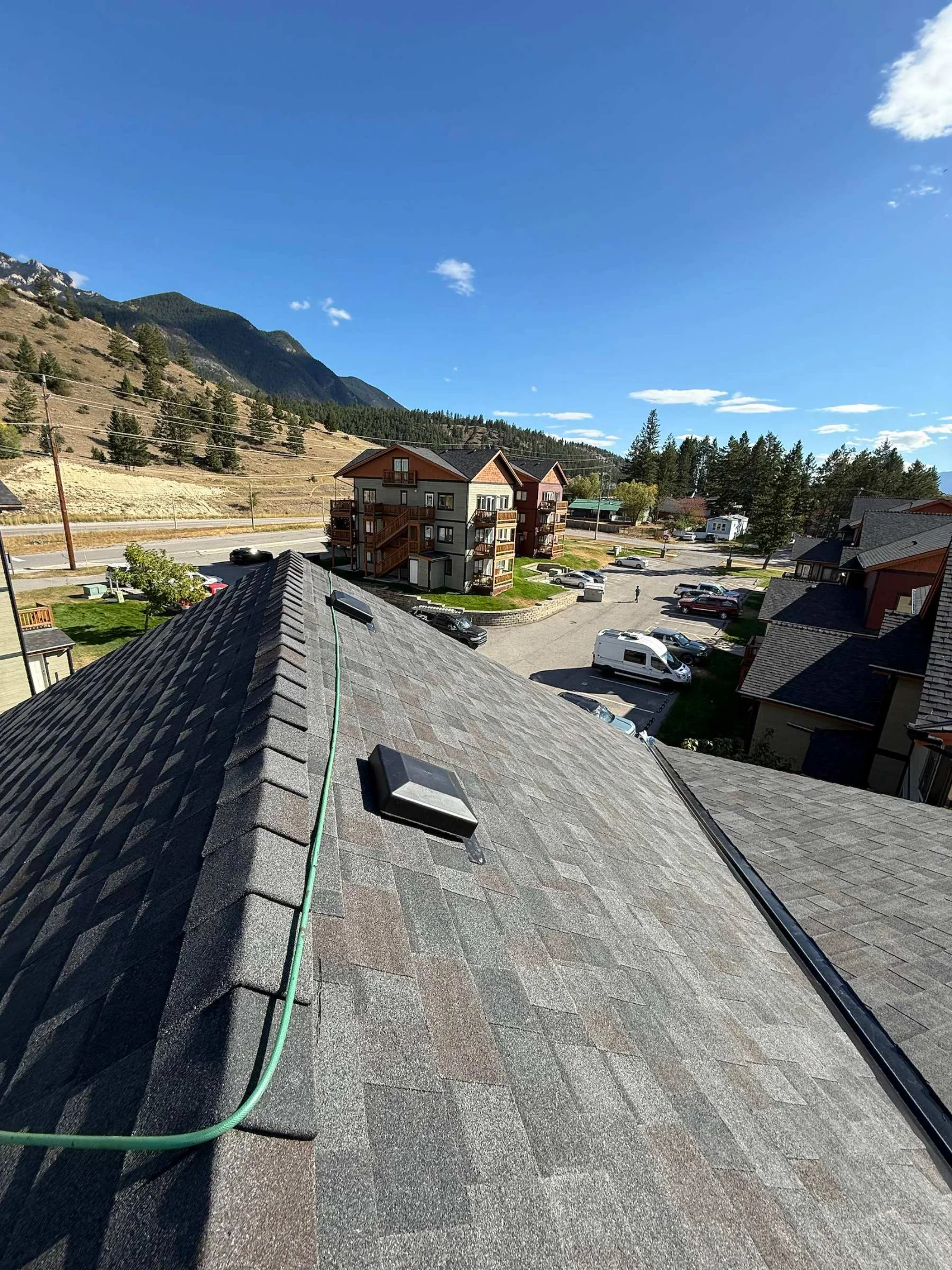 A finished ridge on the new roof with the valley and mountains behind, Radium Hot Springs, BC