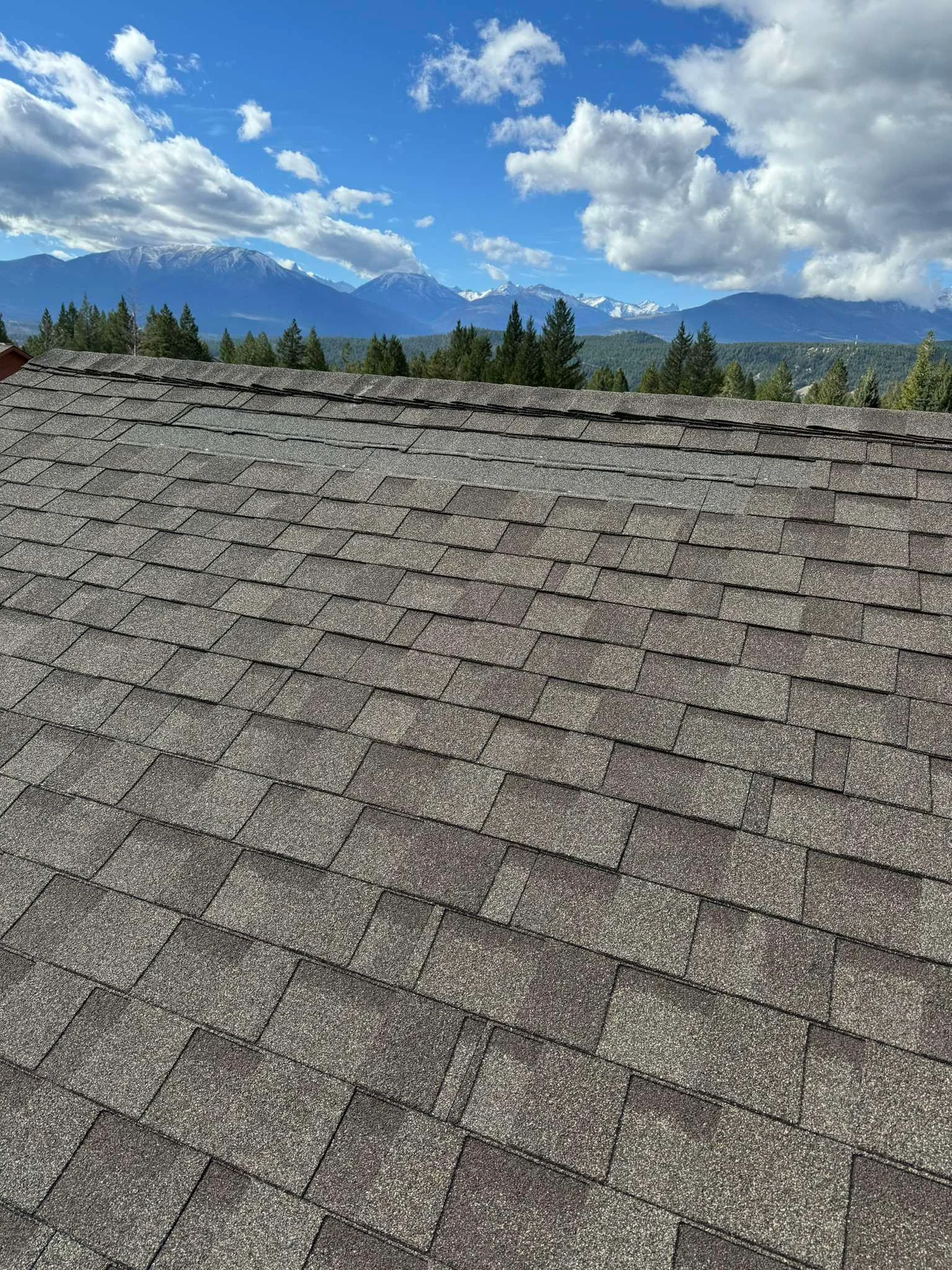 Close-up of the old, faded shingles before replacement, Radium Hot Springs, BC