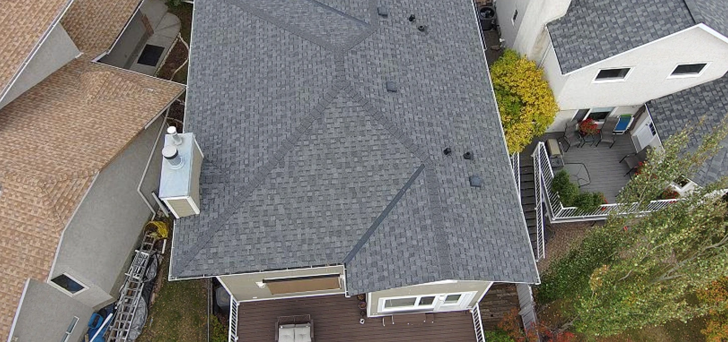 Drone view looking down a roof ridge, Riverbend, Calgary, AB