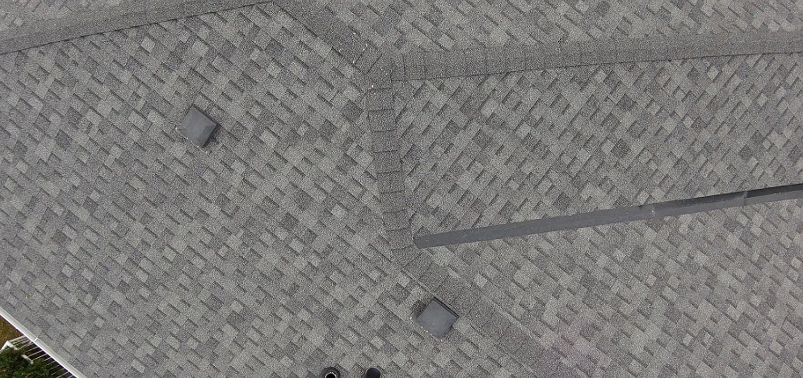 Drone close-up of a roof valley and vents, Riverbend, Calgary, AB