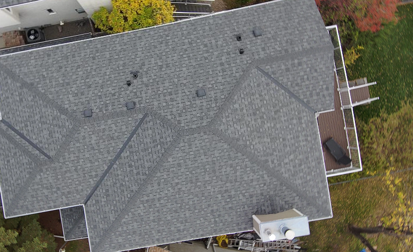 Overhead view of a two-storey home’s full roof, Riverbend, Calgary, AB