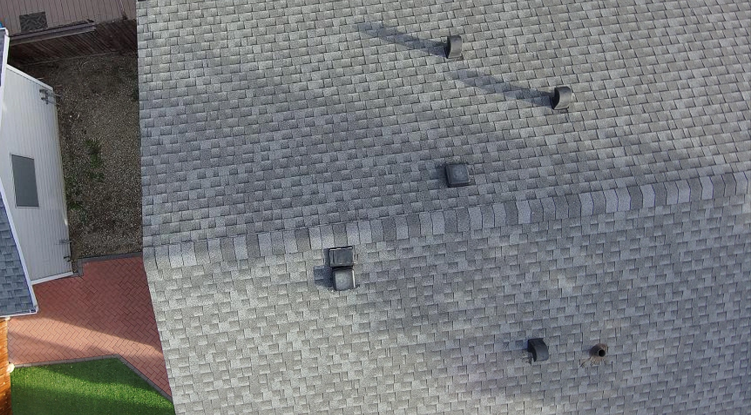 Overhead view of a house and garage before roof replacement, Riverbend, Calgary, AB