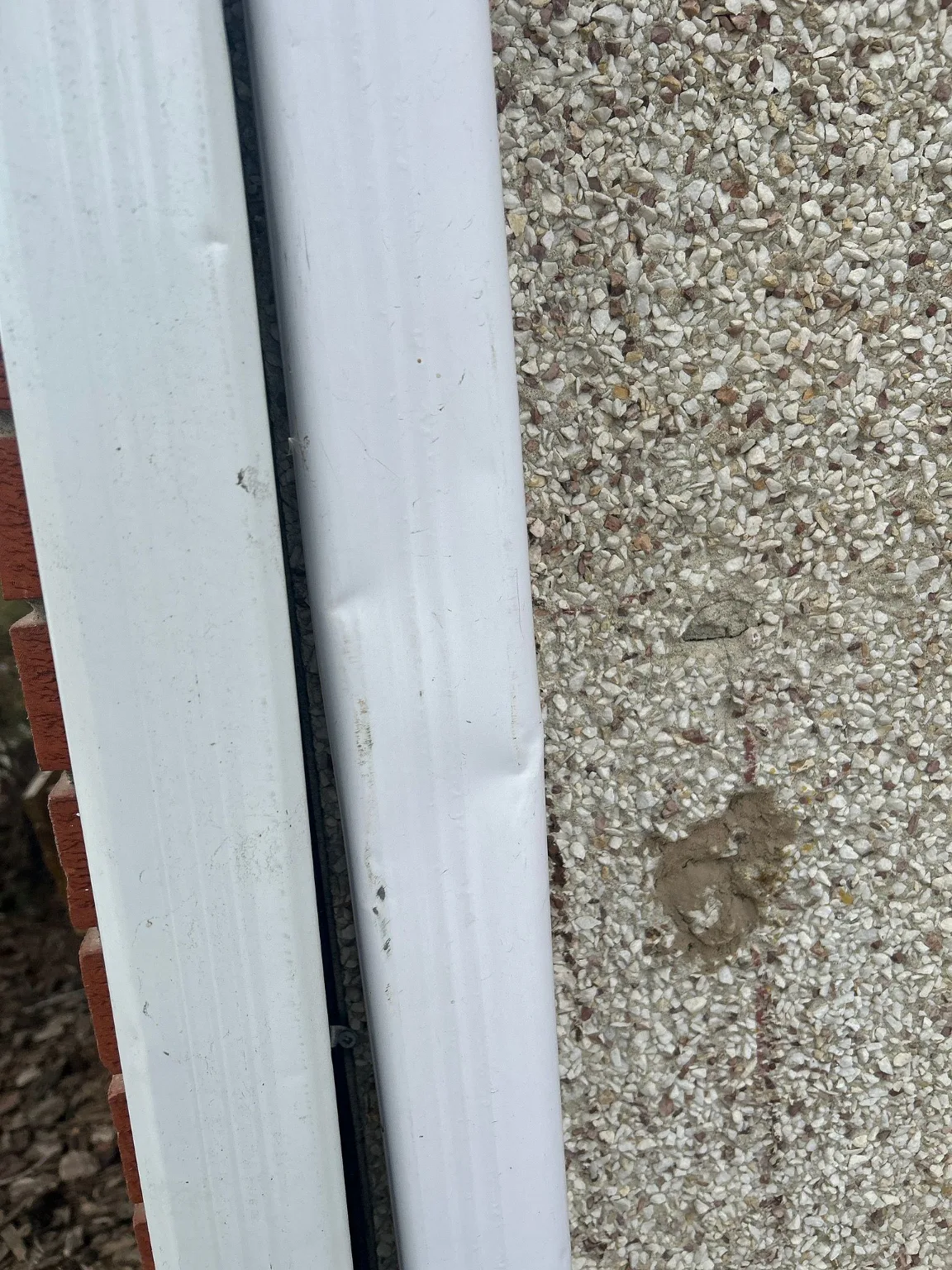 Stucco and corner trim checked before a renovation, Calgary
